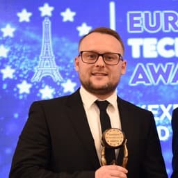 Kyr Poskonoff, founder of pdftoexcel, holding a European Technology Awards trophy